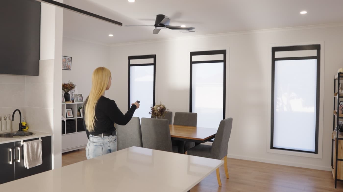 Dual blinds across three dining-area windows, operated by remote.