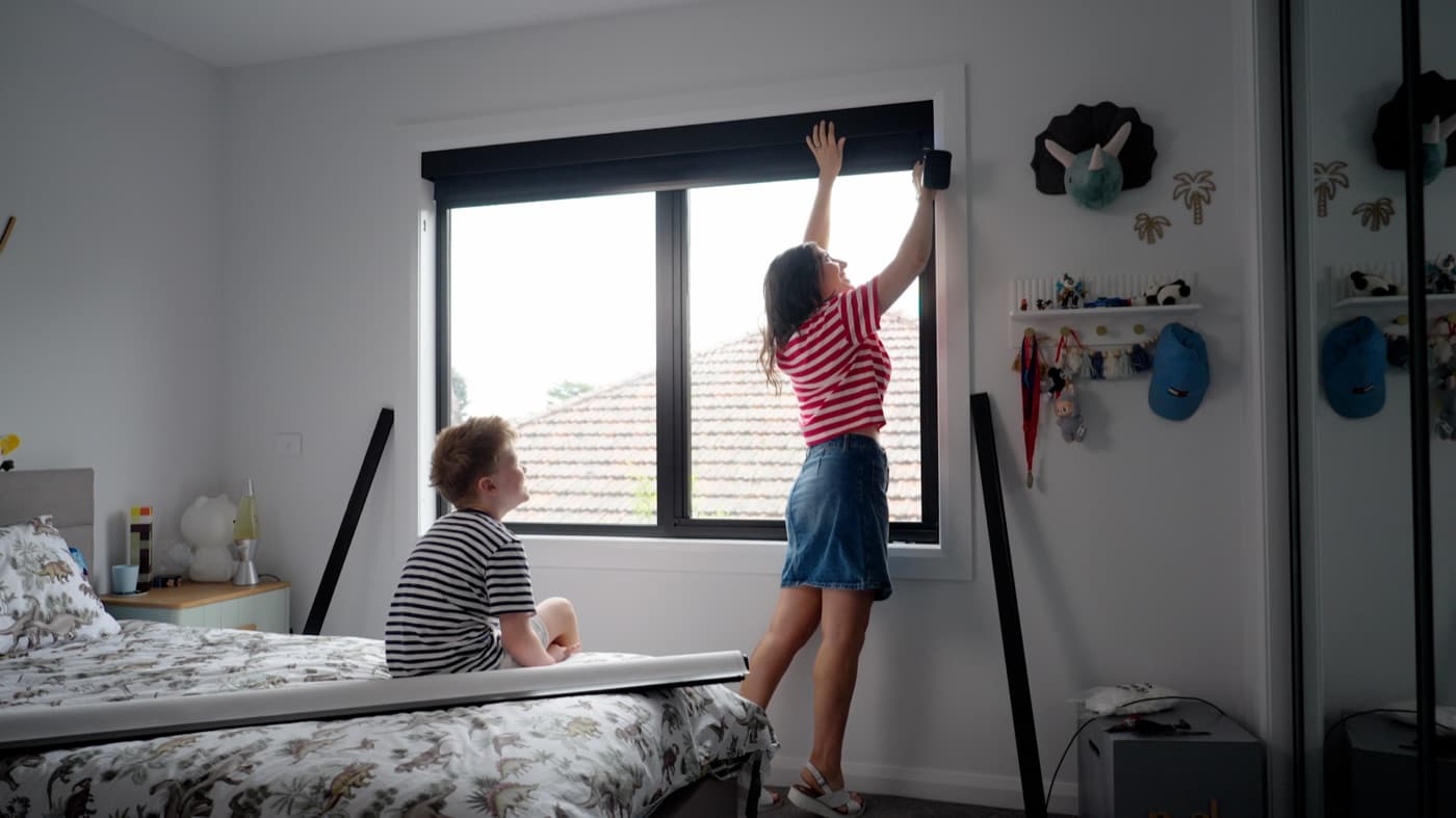 Top pelmet across the head of a bedroom window, closing the gap above the roller.