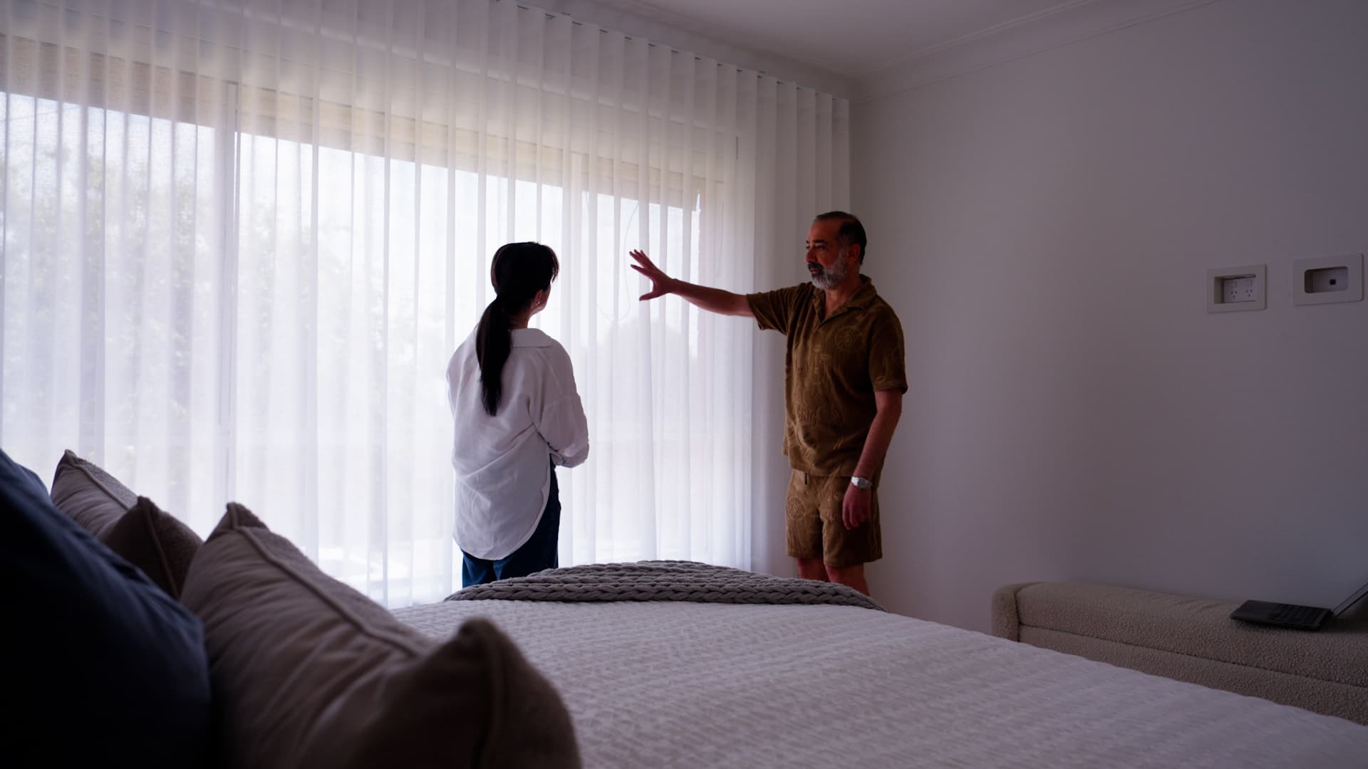 MAB installer measuring a window during a free in-home consult.