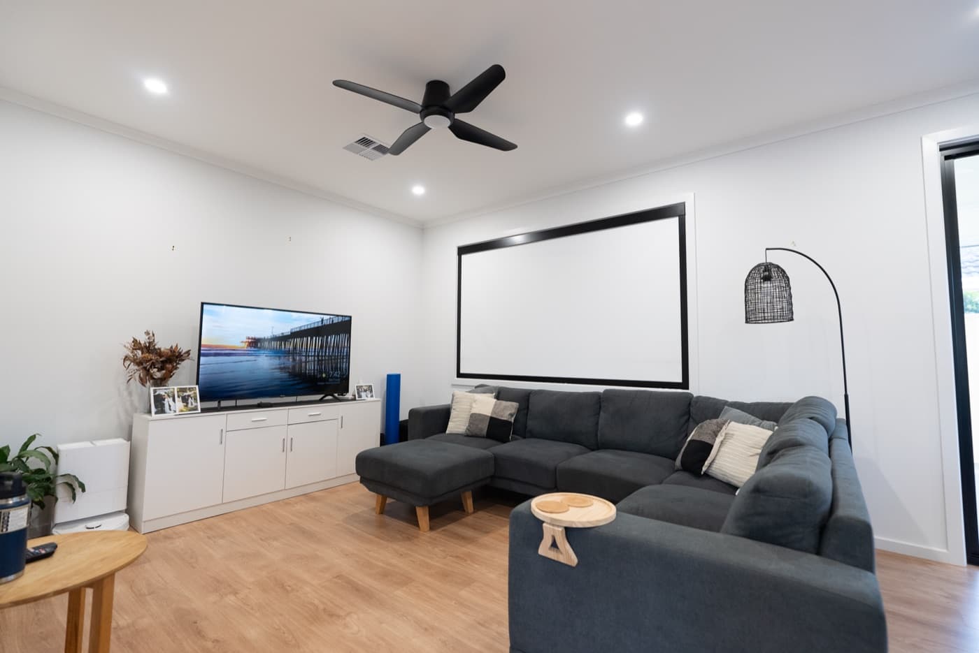 Night mode living room with the blackout blind fully down over the window.