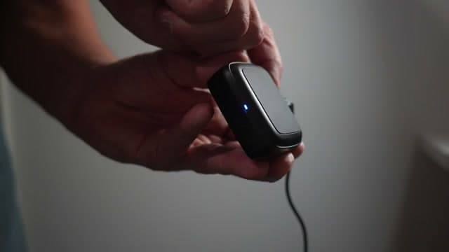 Pressing the program button on the back of the hub until it flashes fast
