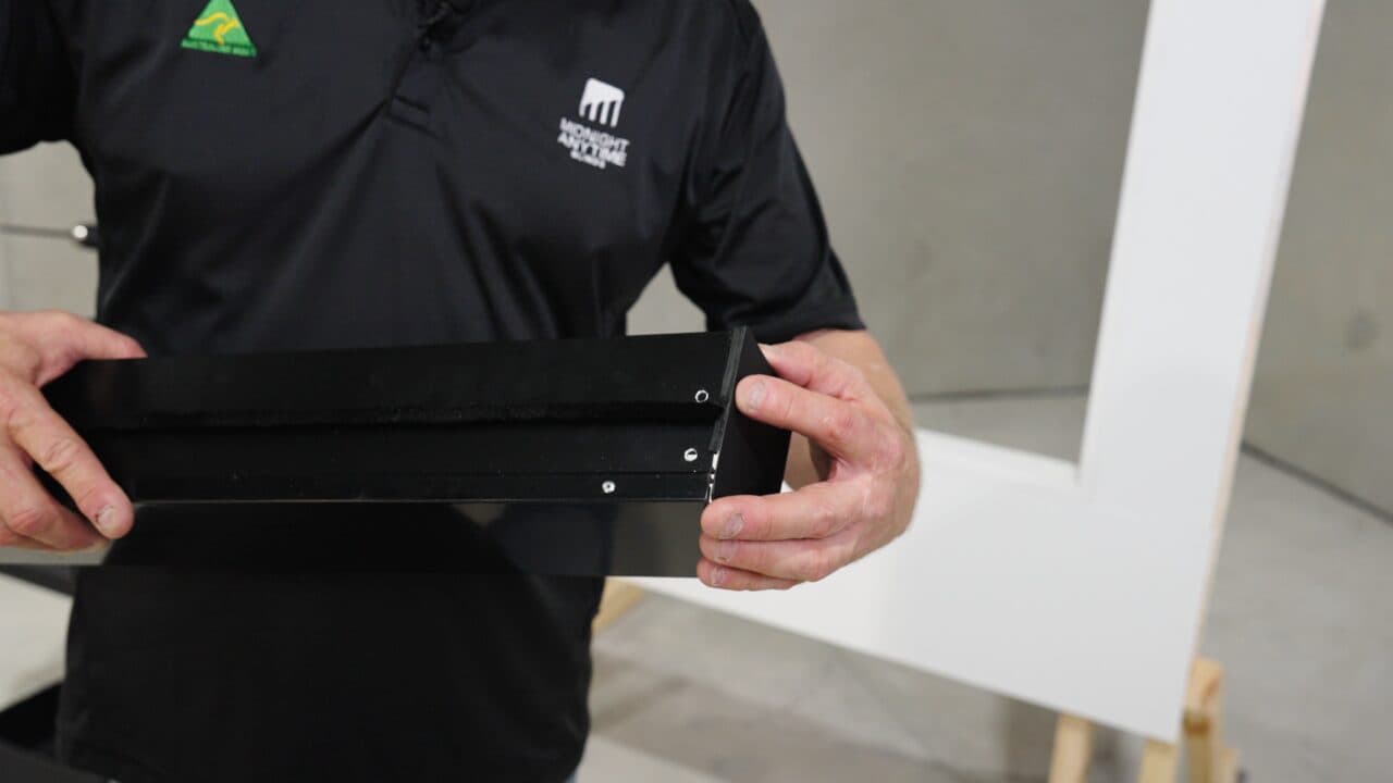 Photo: an end cap snapping onto the pelmet, V at the top.