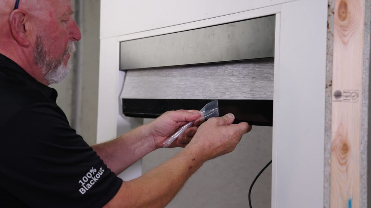 Photo: peeling the clear plastic film off an extrusion.