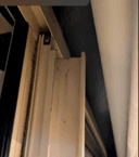 Vertical mullion (centre post) between two window panes.