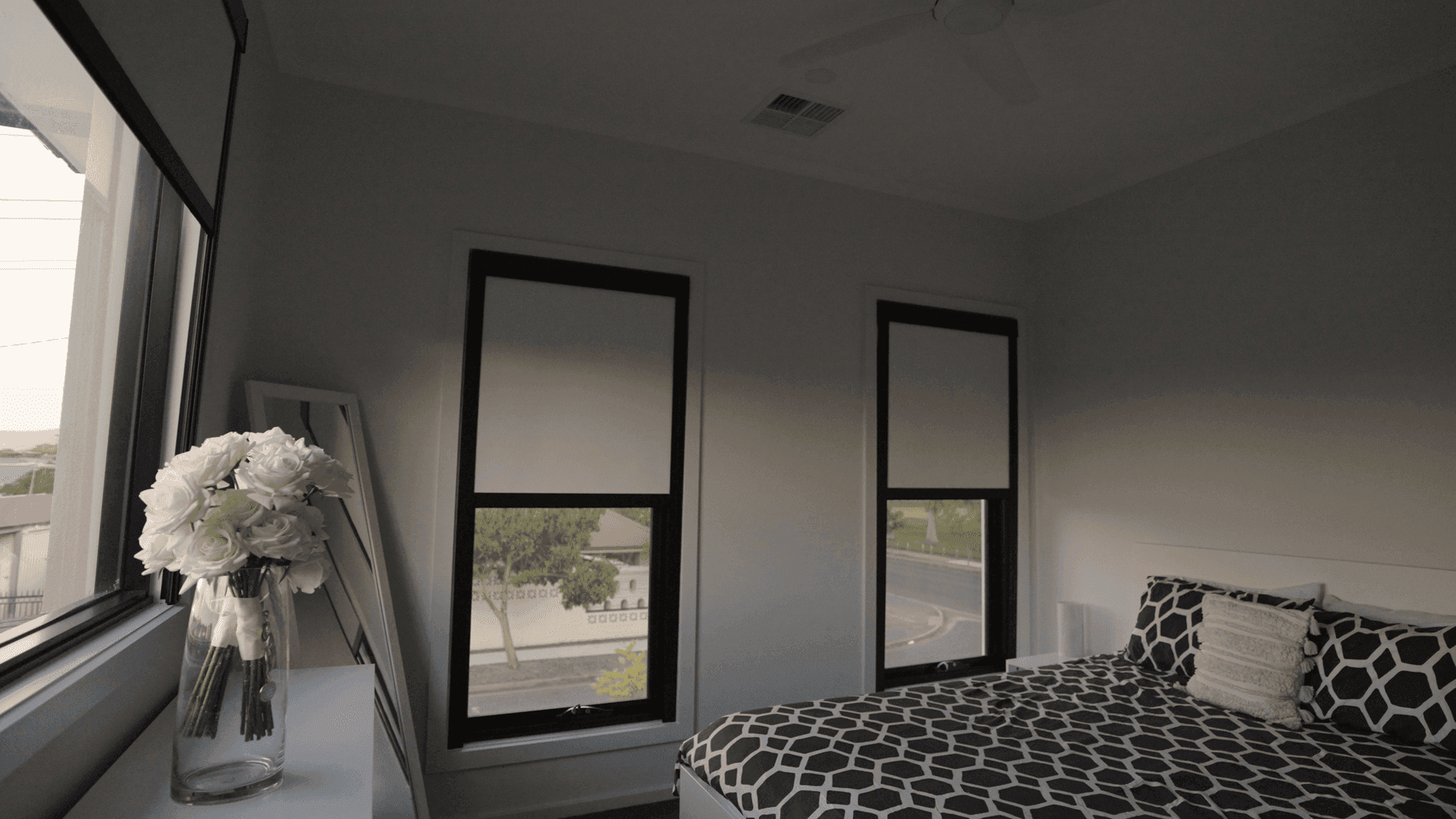 Close-up of the aluminium side track on a motorised blackout blind.